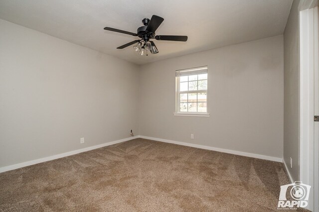 unfurnished room featuring carpet, baseboards, and ceiling fan