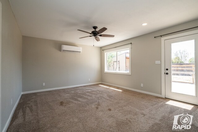 empty room featuring baseboards, ceiling fan, a wall mounted AC, carpet, and recessed lighting
