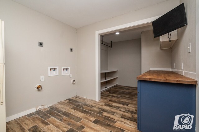 laundry area with hookup for a gas dryer, laundry area, dark wood finished floors, hookup for an electric dryer, and hookup for a washing machine