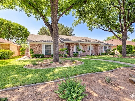 3309 Cedarhill Dr, San Angelo, TX 76904 - ranch-style house featuring a front yard and brick siding