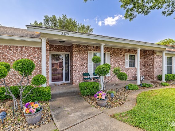 3309 Cedarhill Dr, San Angelo, TX 76904 - view of exterior entry featuring brick siding