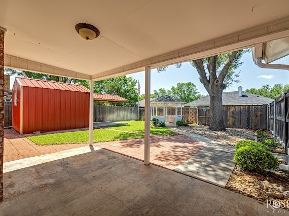 3309 Cedarhill Dr, San Angelo, TX 76904 - view of patio / terrace with a storage shed, an outdoor structure, and a gazebo