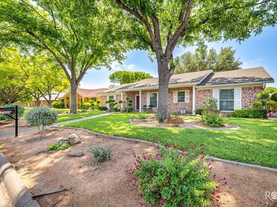 3309 Cedarhill Dr, San Angelo, TX 76904 - single story home with a front lawn and brick siding