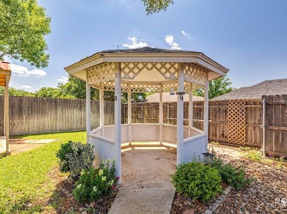 3309 Cedarhill Dr, San Angelo, TX 76904 - view of patio with a gazebo and a fenced backyard
