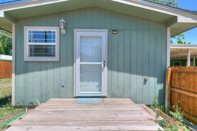 doorway to property with fence