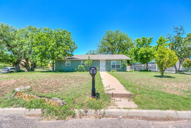 ranch-style home with a front yard