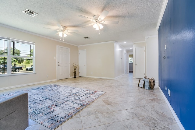 foyer with ceiling fan, crown molding, a textured ceiling, and baseboards