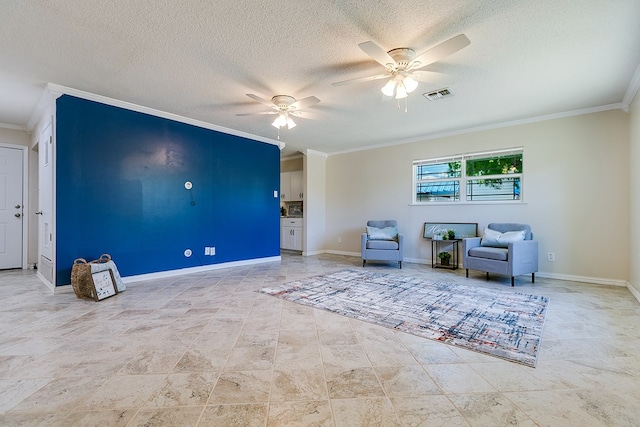 sitting room with ornamental molding, a ceiling fan, a textured ceiling, and baseboards