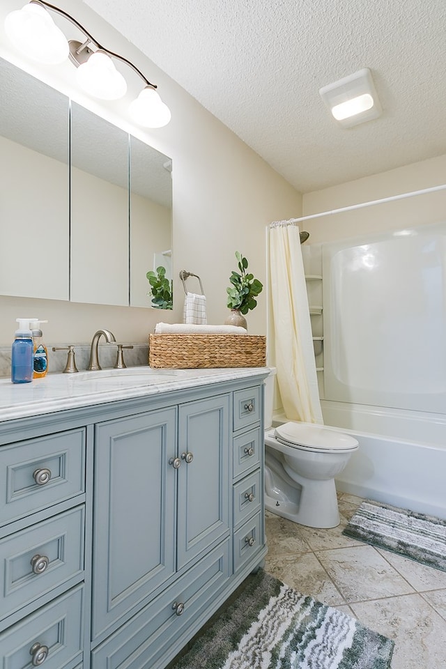 bathroom with vanity, toilet, shower / bath combo, and a textured ceiling