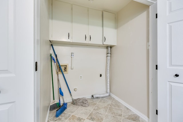 laundry room with electric dryer hookup, hookup for a washing machine, cabinet space, and baseboards