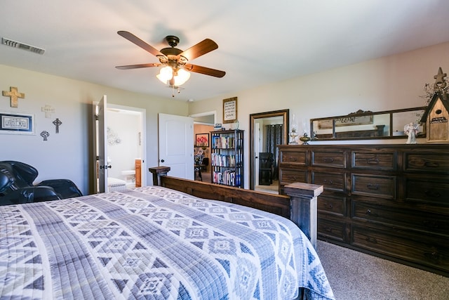 bedroom with ceiling fan, carpet floors, and ensuite bath