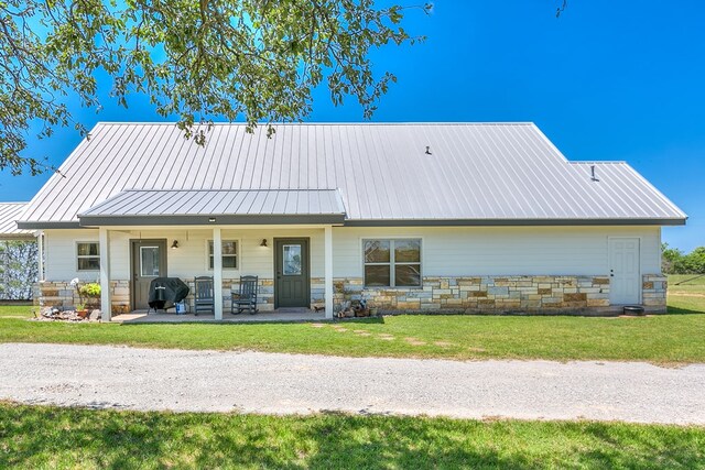 16967 County Rd 290, Zephyr, TX 76890 - rear view of property with a porch and a lawn