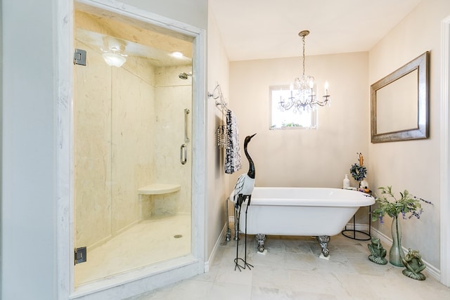 bathroom featuring a chandelier and independent shower and bath