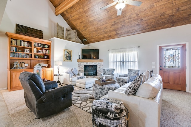 carpeted living room featuring ceiling fan, high vaulted ceiling, a fireplace, wooden ceiling, and beamed ceiling