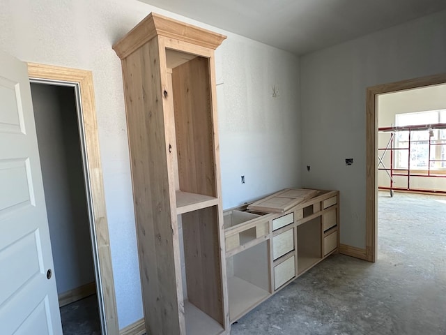 kitchen featuring unfinished concrete floors