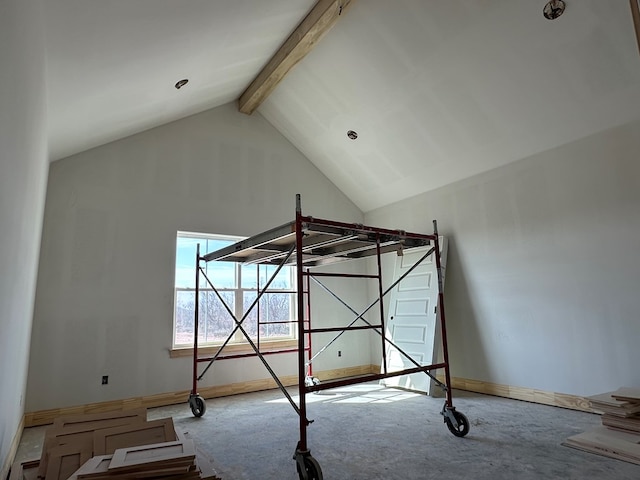 unfurnished bedroom featuring beam ceiling and high vaulted ceiling