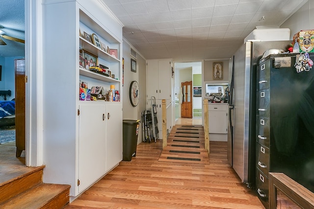 hallway with light hardwood / wood-style flooring