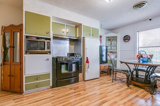 kitchen with light hardwood / wood-style flooring, green cabinets, a textured ceiling, black range, and high end refrigerator