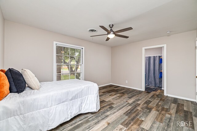 1902 College Hills Blvd, San Angelo, TX 76904 - bedroom featuring wood finished floors, baseboards, a ceiling fan, and a spacious closet