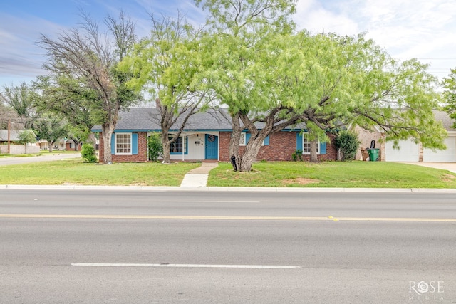 1902 College Hills Blvd, San Angelo, TX 76904 - single story home with a front lawn, concrete driveway, and brick siding