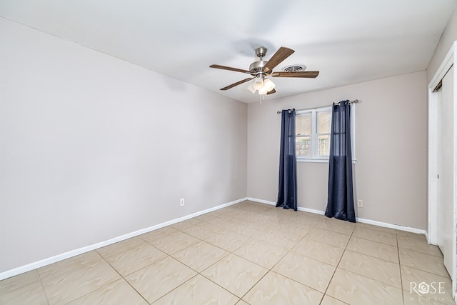 1902 College Hills Blvd, San Angelo, TX 76904 - empty room with a ceiling fan, baseboards, and light tile patterned floors