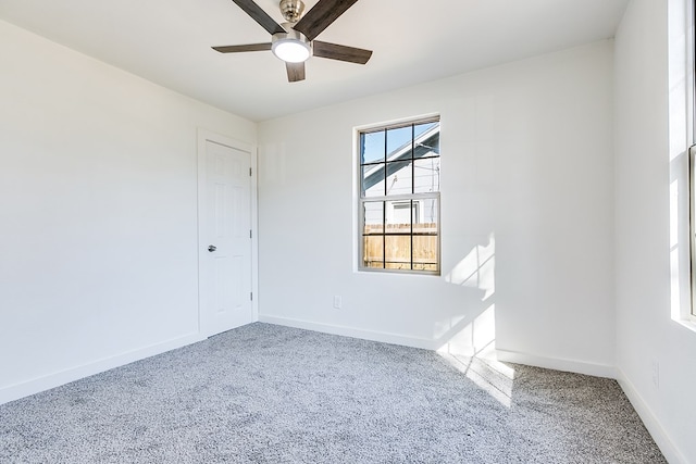 spare room featuring ceiling fan and carpet flooring