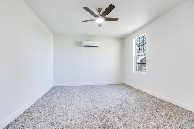 empty room with ceiling fan, a wall mounted AC, and carpet