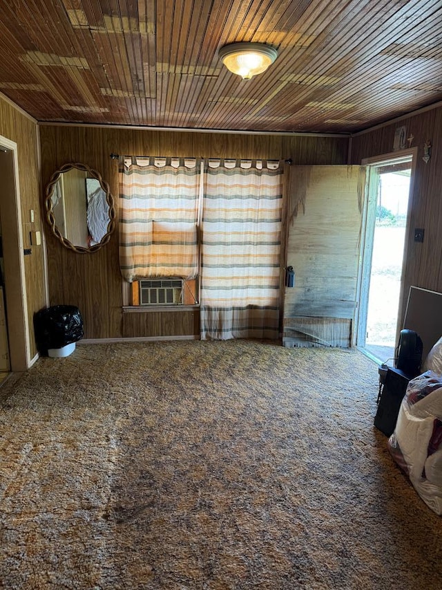 carpeted empty room with wooden walls, cooling unit, and wood ceiling