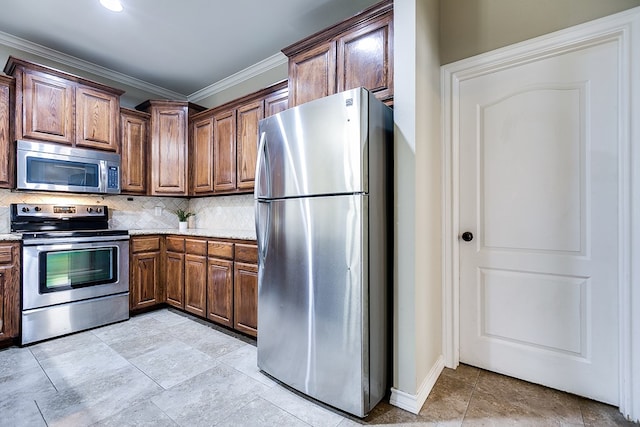 kitchen with appliances with stainless steel finishes, ornamental molding, and tasteful backsplash