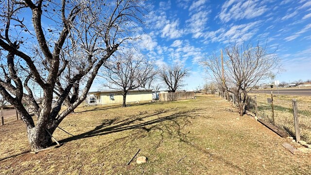 view of yard with a rural view