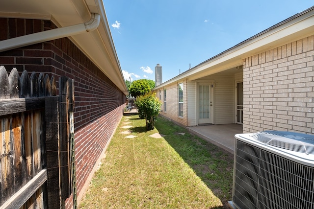 view of yard featuring a patio and central AC