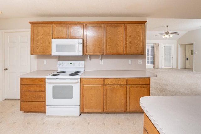 4206 Pinon Ridge Dr, San Angelo, TX 76904 - kitchen with white appliances, light countertops, brown cabinetry, a ceiling fan, and lofted ceiling