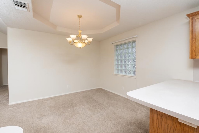 4206 Pinon Ridge Dr, San Angelo, TX 76904 - unfurnished dining area featuring carpet flooring, a chandelier, a raised ceiling, and baseboards