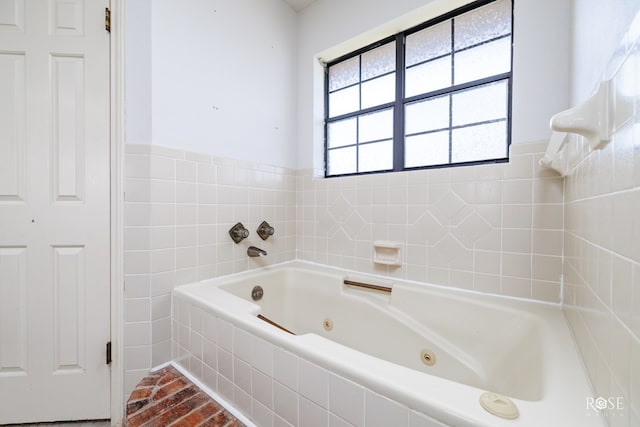 bathroom with a relaxing tiled tub