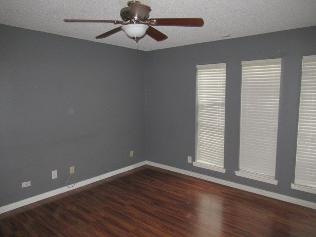 3606 Old Post Rd, San Angelo, TX 76904 - unfurnished room with wood finished floors, a ceiling fan, and a textured ceiling