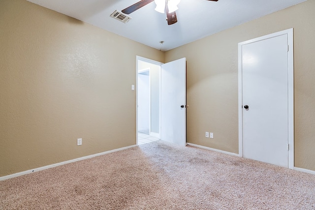 3101 Grove Dr, San Angelo, TX 76903 - unfurnished bedroom with carpet flooring and ceiling fan