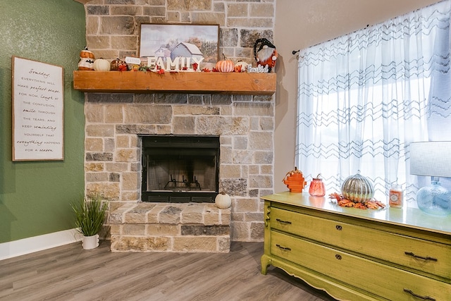3406 Twin Mountain Dr, San Angelo, TX 76904 - detailed view of wood finished floors and a stone fireplace