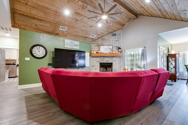 3406 Twin Mountain Dr, San Angelo, TX 76904 - living room featuring a ceiling fan, wood finished floors, a wood ceiling with exposed beams, a stone fireplace, and recessed lighting