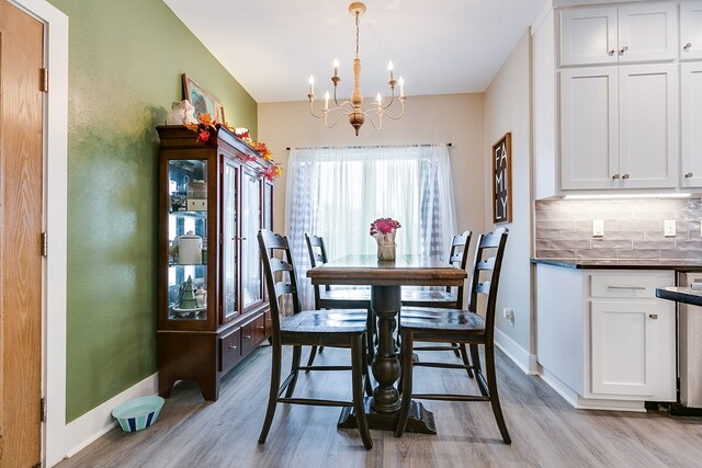 3406 Twin Mountain Dr, San Angelo, TX 76904 - dining space featuring a chandelier and light wood-style floors