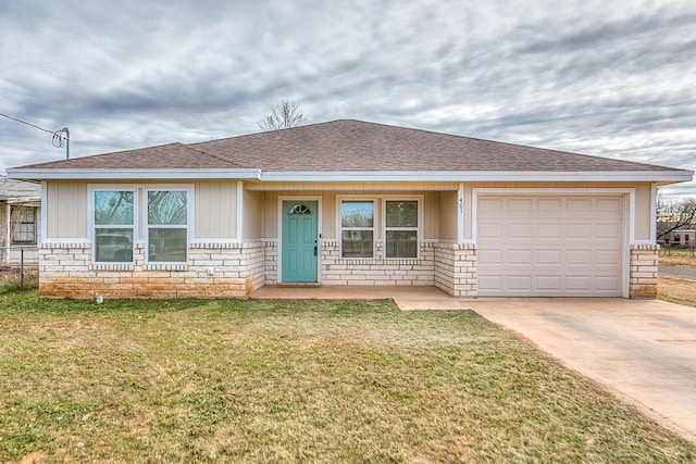 ranch-style home featuring a garage and a front yard