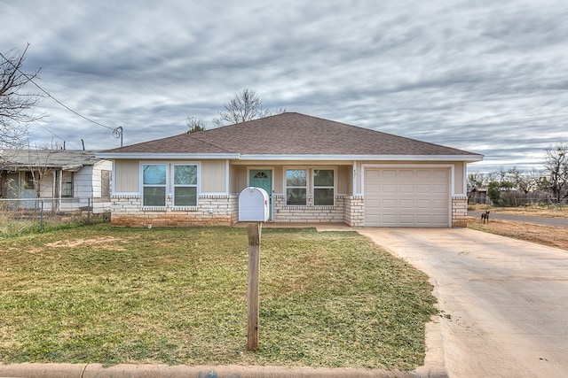 ranch-style house featuring a garage and a front lawn