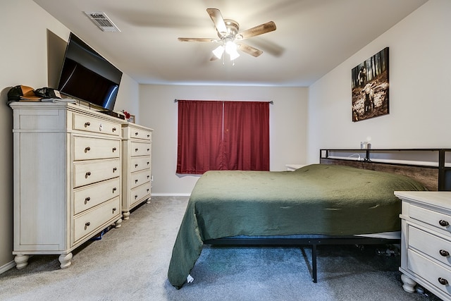 bedroom featuring light carpet and ceiling fan