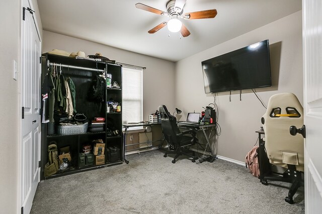 office with carpet floors and ceiling fan