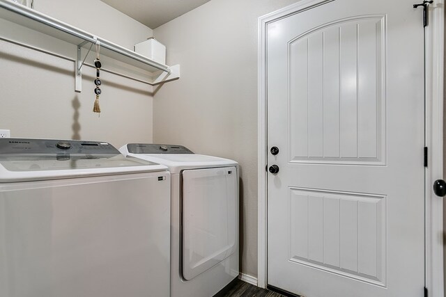 clothes washing area with washing machine and dryer