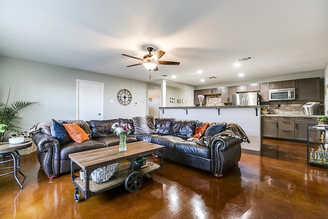 living room featuring ceiling fan