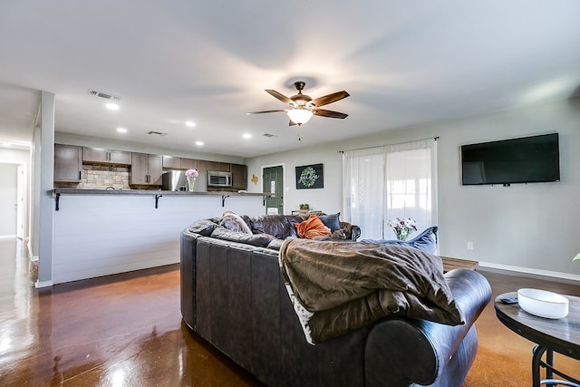 living room featuring ceiling fan