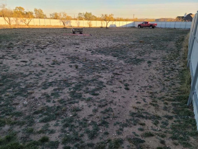 view of yard at dusk