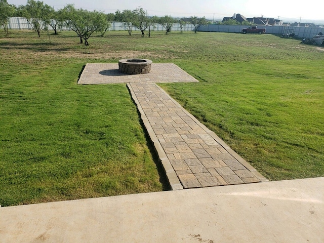 view of yard featuring a patio and a fire pit