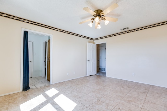 261 Edinburgh Rd, San Angelo, TX 76901 - empty room featuring a textured ceiling, baseboards, ceiling fan, and visible vents