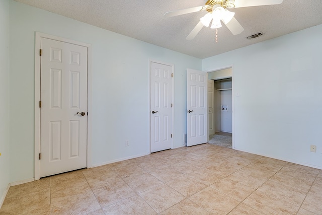 261 Edinburgh Rd, San Angelo, TX 76901 - unfurnished bedroom featuring visible vents, a ceiling fan, tile patterned flooring, and a textured ceiling